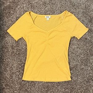 Pretty bright yellow color. Super comfortable and great for summer.